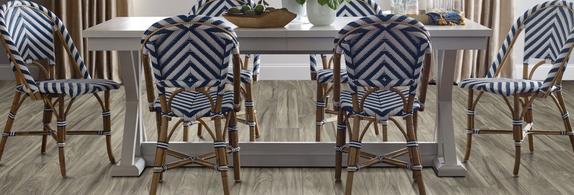 Chairs around a table on a laminate floor - Floors2Interiors in TX